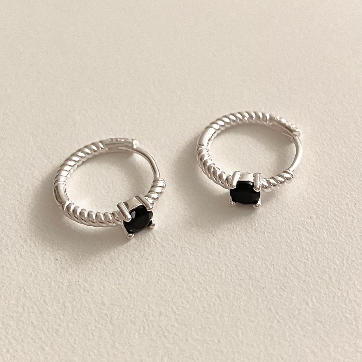 Twisted Silver Huggie Earrings with Black Stone