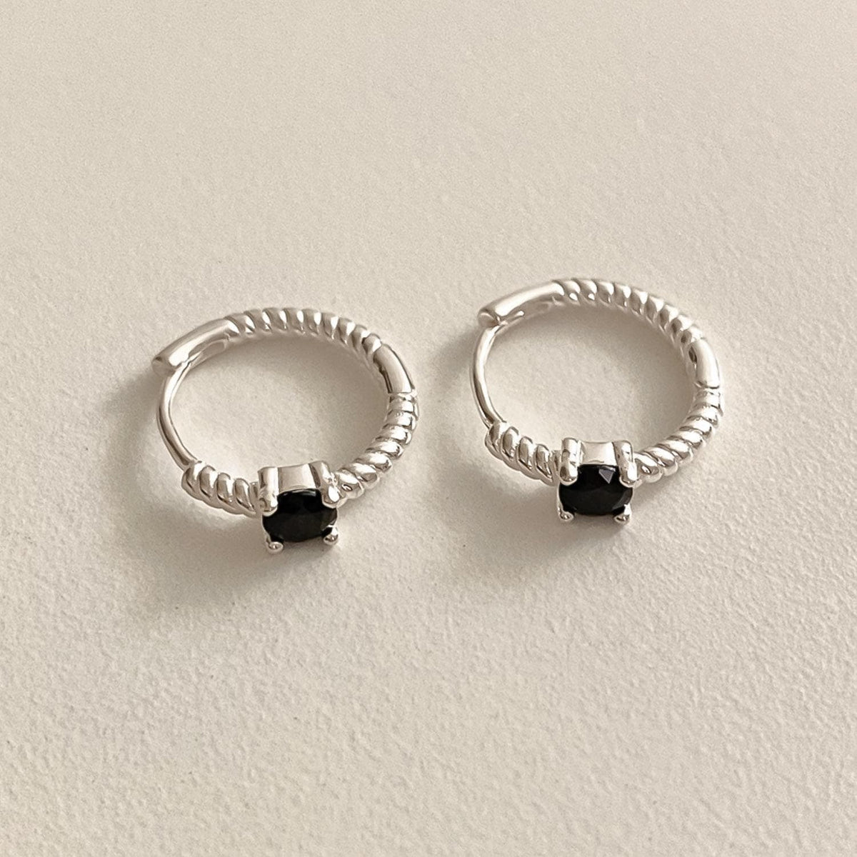 Twisted Silver Huggie Earrings with Black Stone