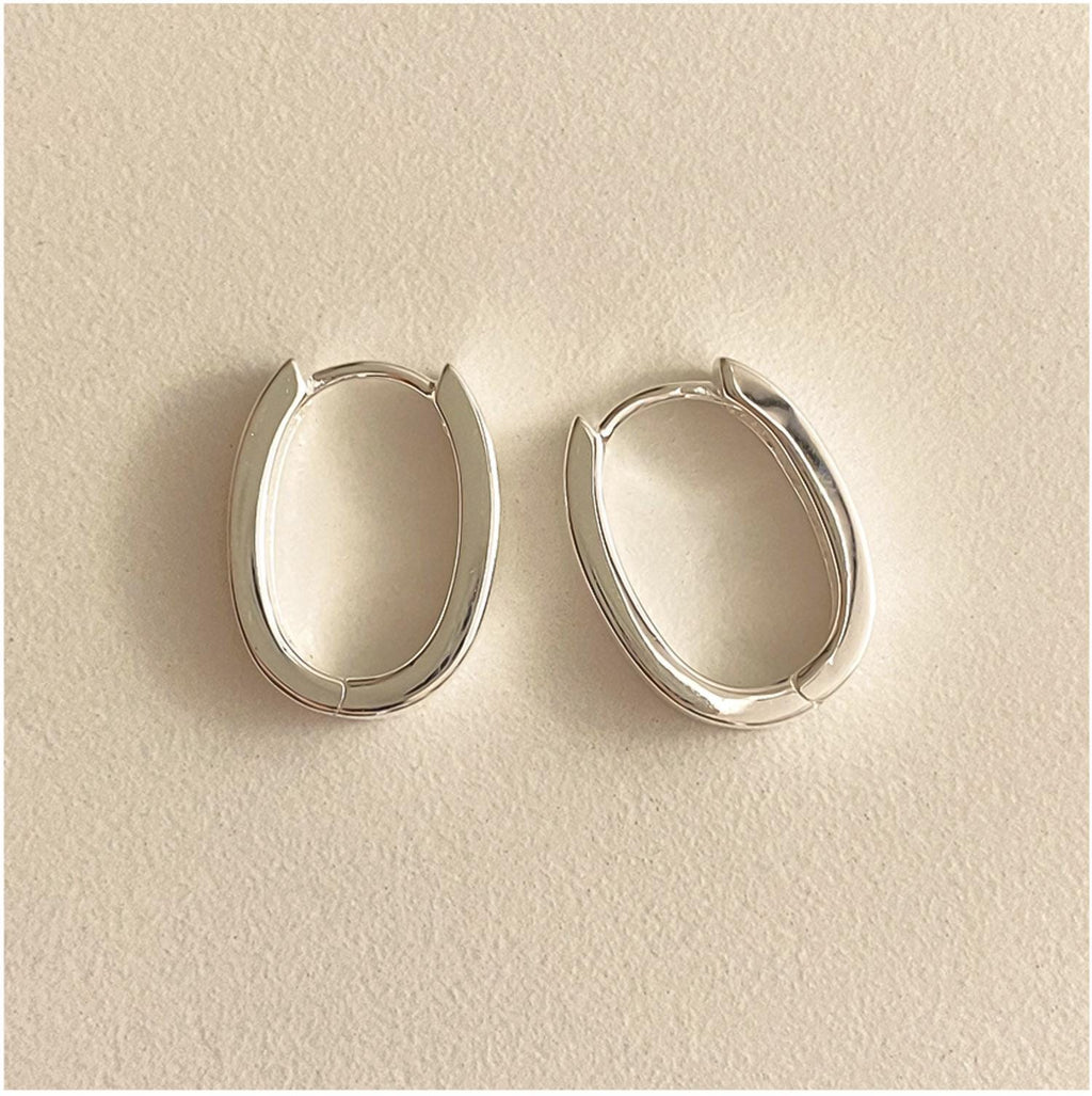 Sleek Oval Silver Huggie Earrings