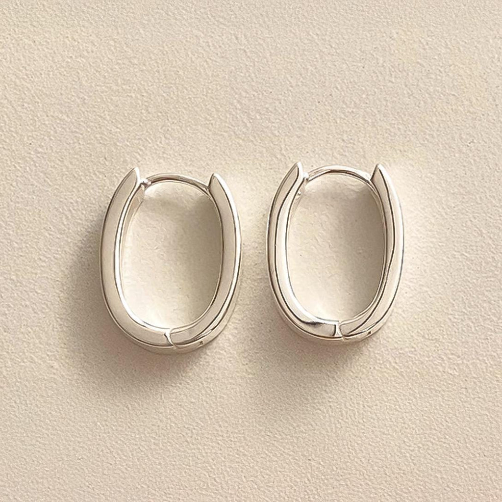 Sleek Oval Silver Huggie Earrings