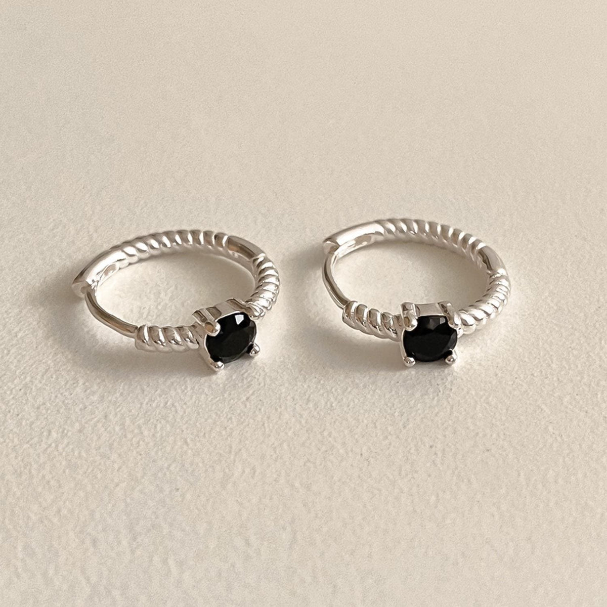 Twisted Silver Huggie Earrings with Black Stone