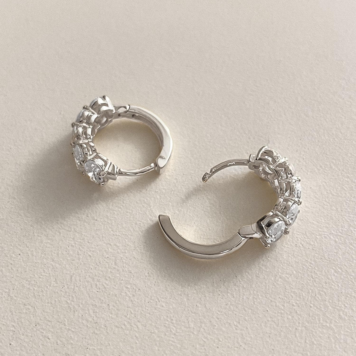 Oval CZ Cluster Huggie Earrings