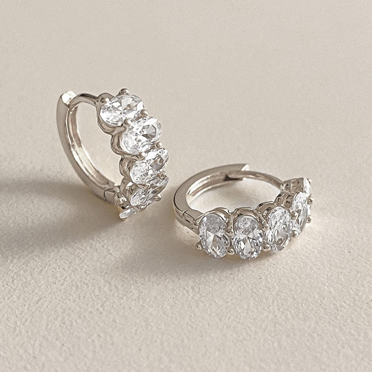 Oval CZ Cluster Huggie Earrings