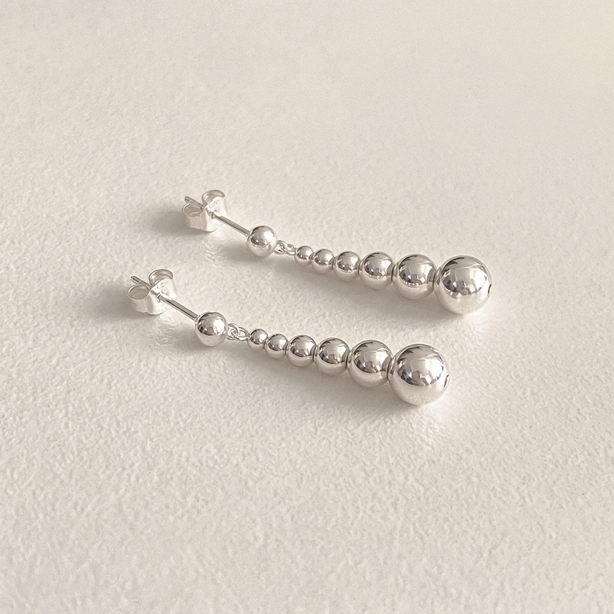 Graduated Silver Ball Drop Earrings