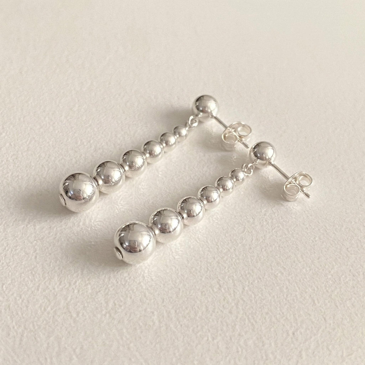 Graduated Silver Ball Drop Earrings