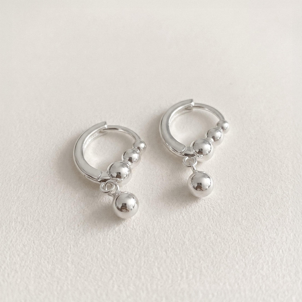 Silver Ball Charm Huggie Earrings