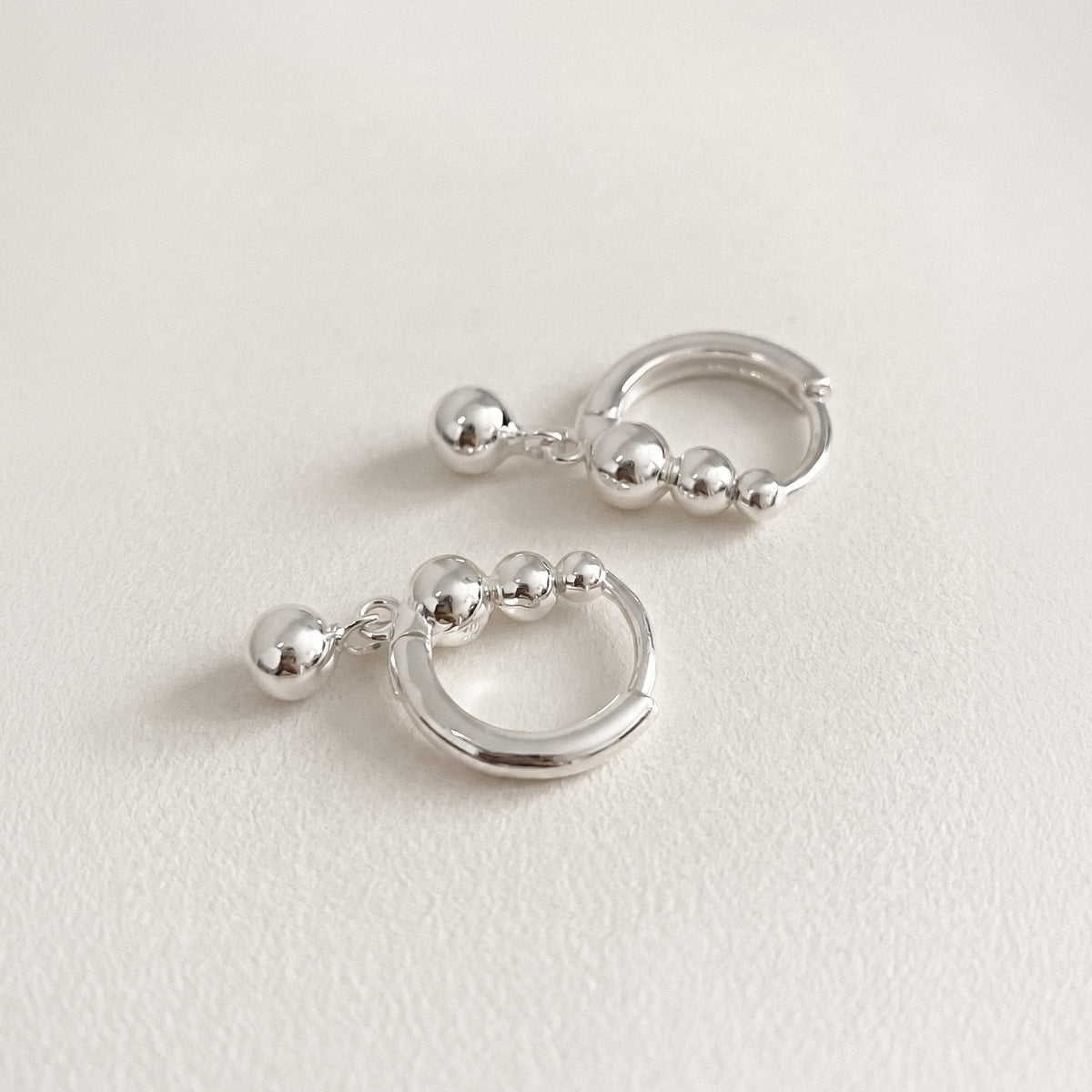 Silver Ball Charm Huggie Earrings
