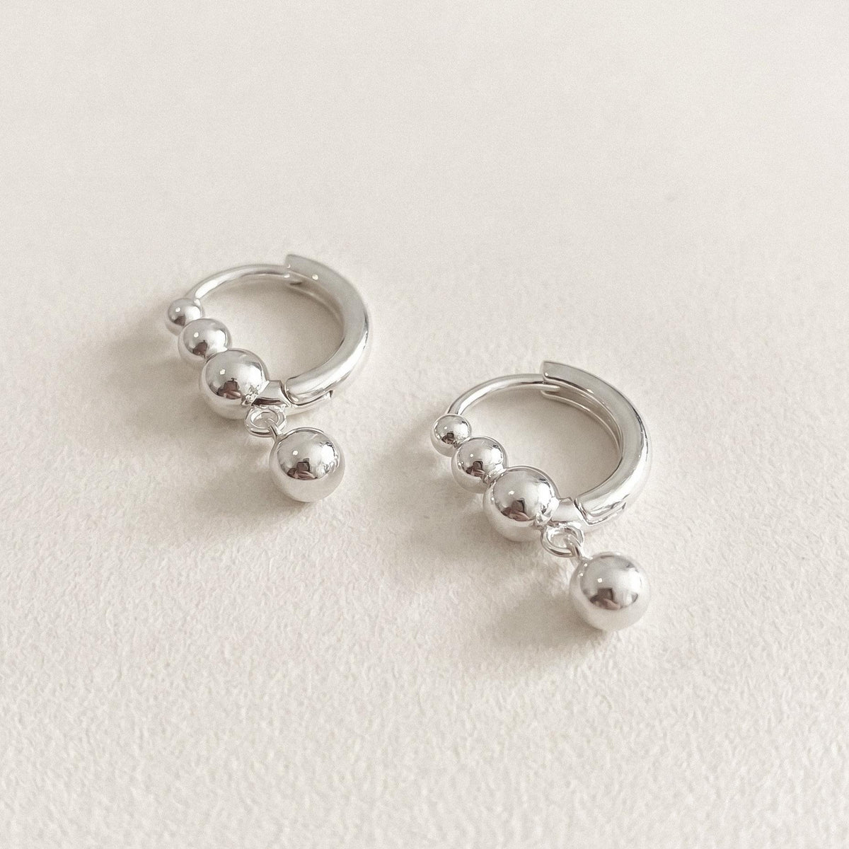 Silver Ball Charm Huggie Earrings
